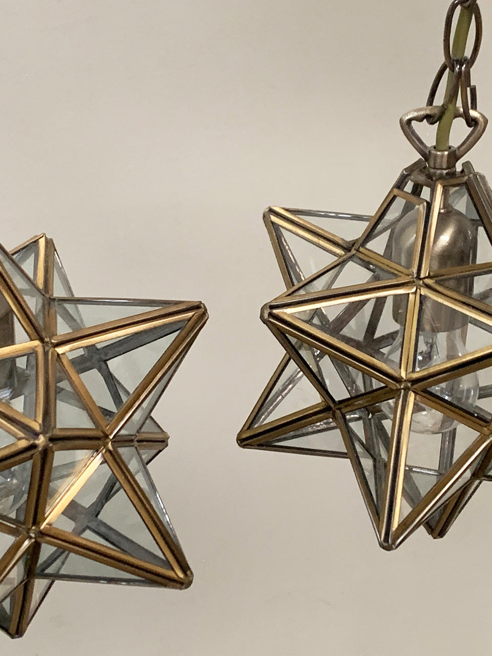 Pair of brass and glass 'star' pendants