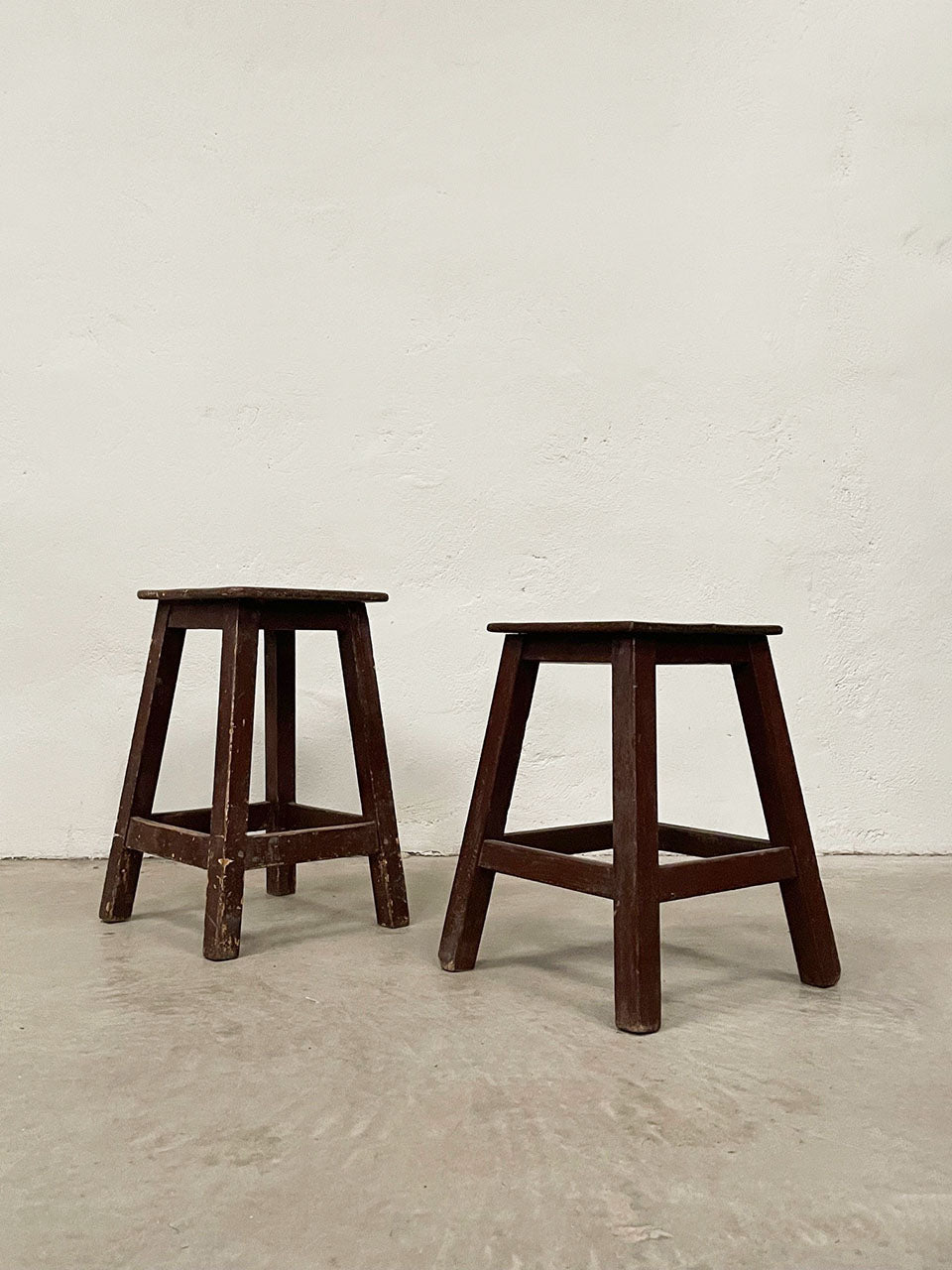 Two brown painted stools (each)