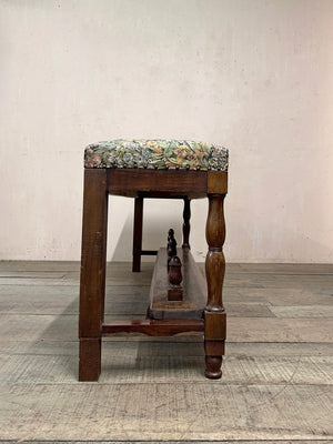 Upholstered bench with folding footstool