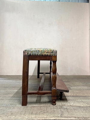 Upholstered bench with folding footstool