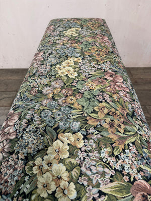 Upholstered bench with folding footstool