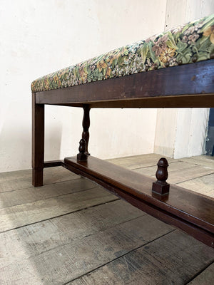Upholstered bench with folding footstool