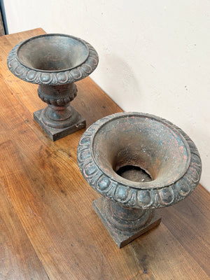 Pair of iron urns