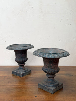 Pair of iron urns
