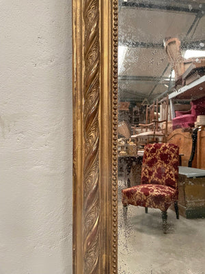 Tall gilded mirror with cherub crest