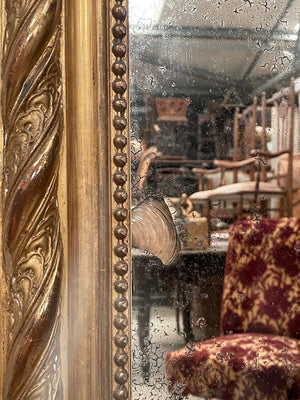 Tall gilded mirror with cherub crest