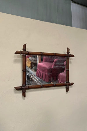 Faux bamboo mirror with foxed plate