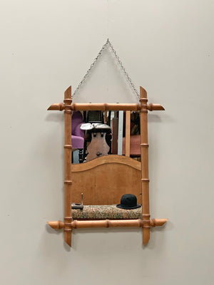 Faux bamboo mirror with long chain