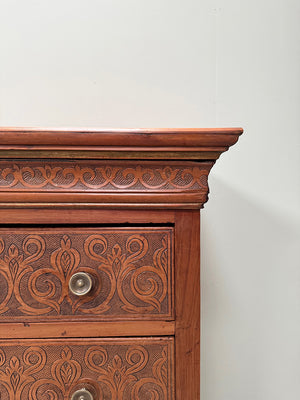 Carved front chest of drawers
