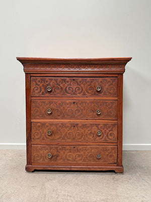 Carved front chest of drawers