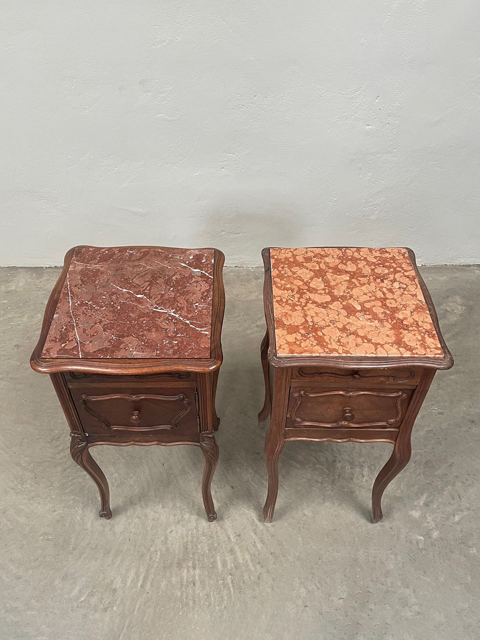 Near pair of marble top bedsides