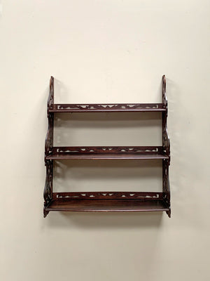 Openwork wall shelves