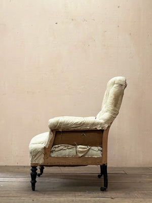 Deep buttoned armchair