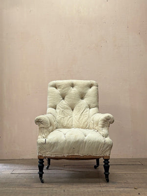 Deep buttoned armchair