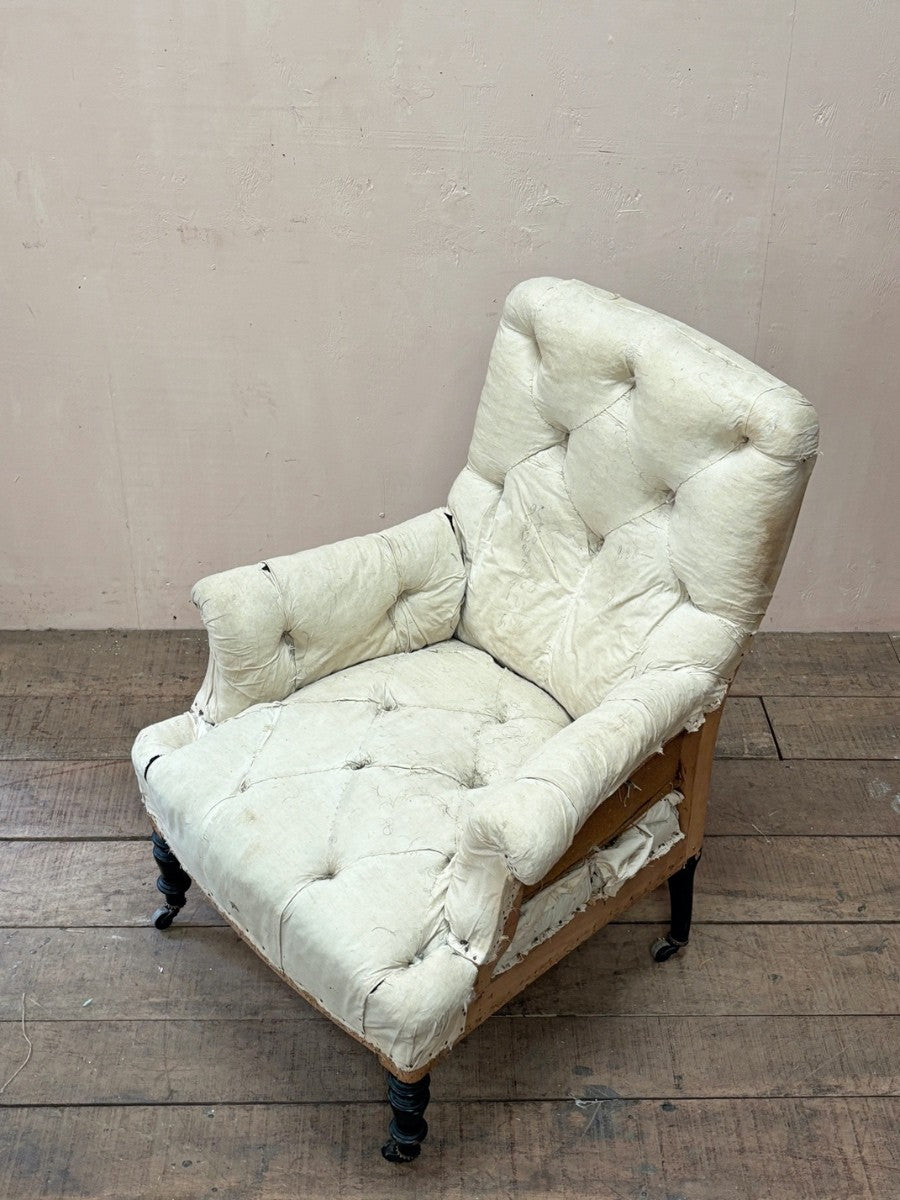 Deep buttoned armchair