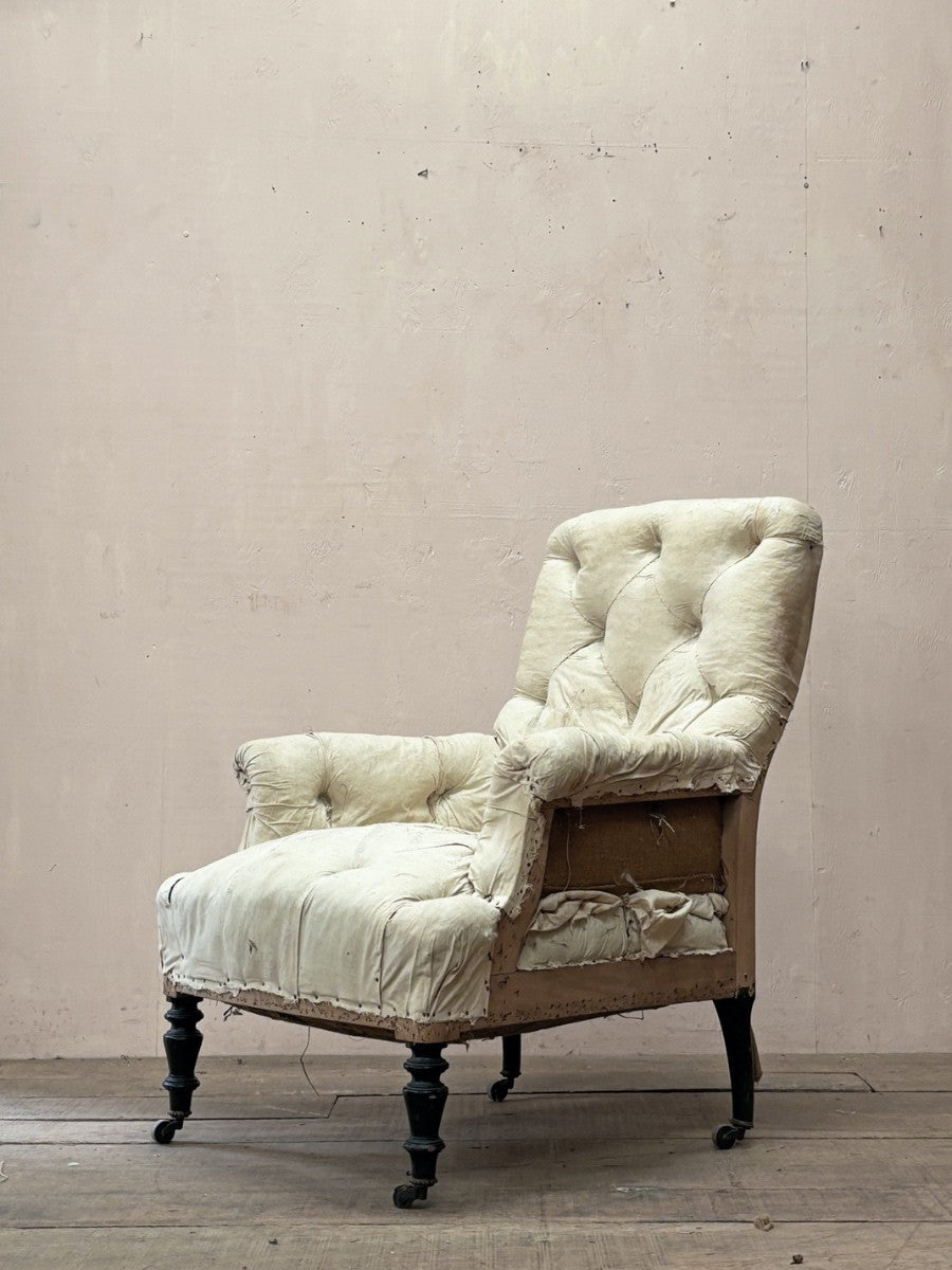 Deep buttoned armchair