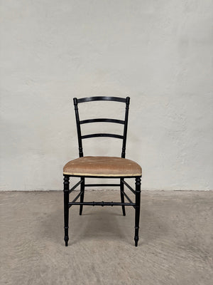 Set of ebonised dining chairs