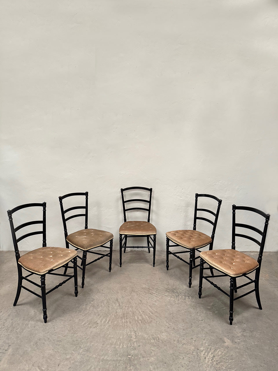 Set of ebonised dining chairs