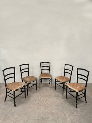 Set of ebonised dining chairs