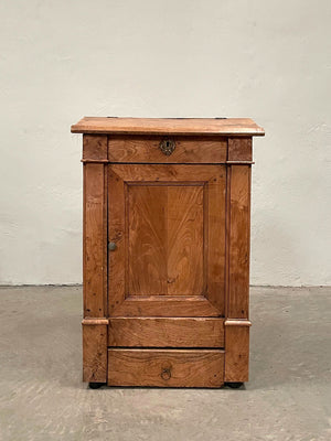 Cabinet with sloping top