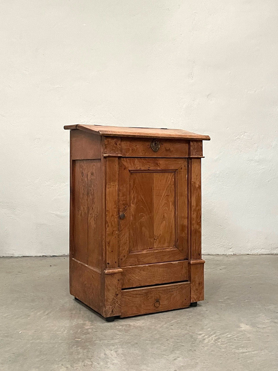 Cabinet with sloping top