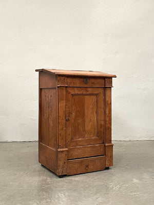 Cabinet with sloping top