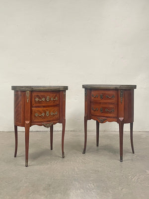 Near pair of marble top bedside tables