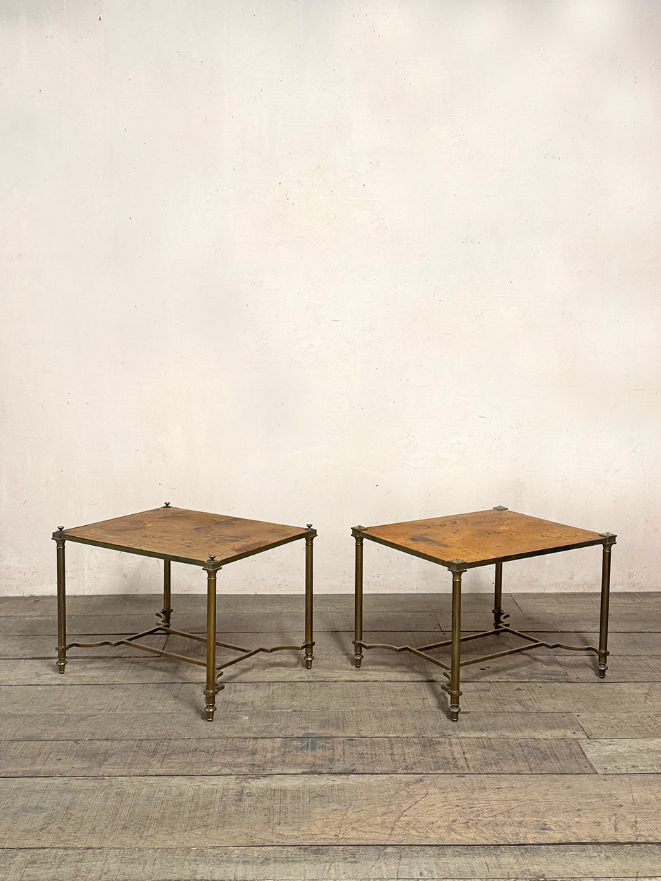 Pair of worn leather top tables