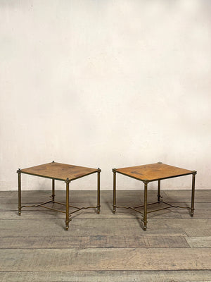 Pair of worn leather top tables
