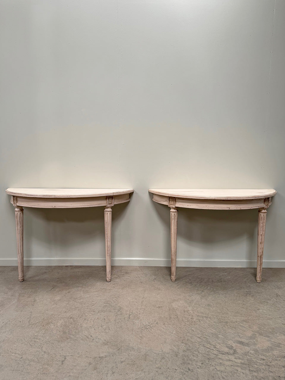 Pair of demi lune console tables