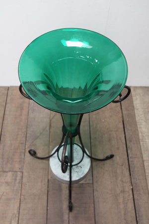 Green glass vase in stand